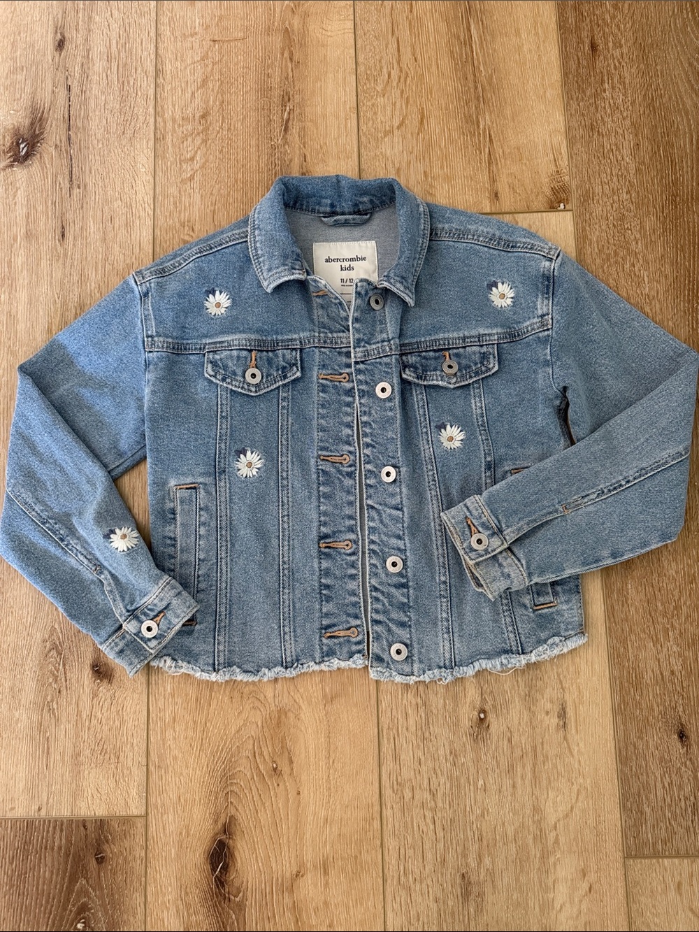 abercrombie kids | light blue denim jacket with daisy embroidery raw hem | 11/12